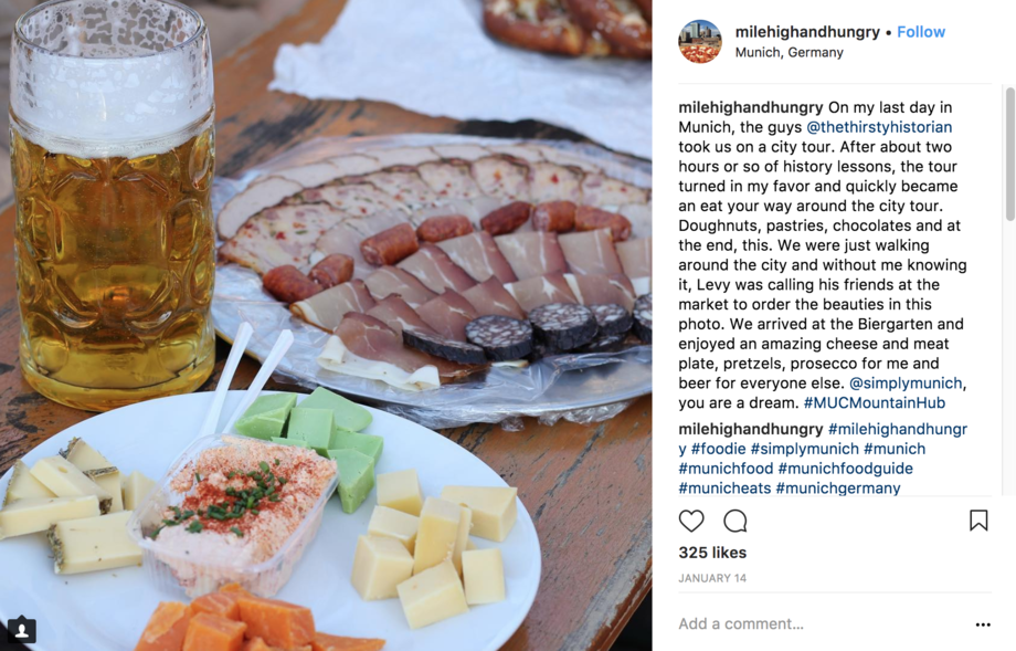 Cheese and meat trays with a large mug of beer. Comments to the right.